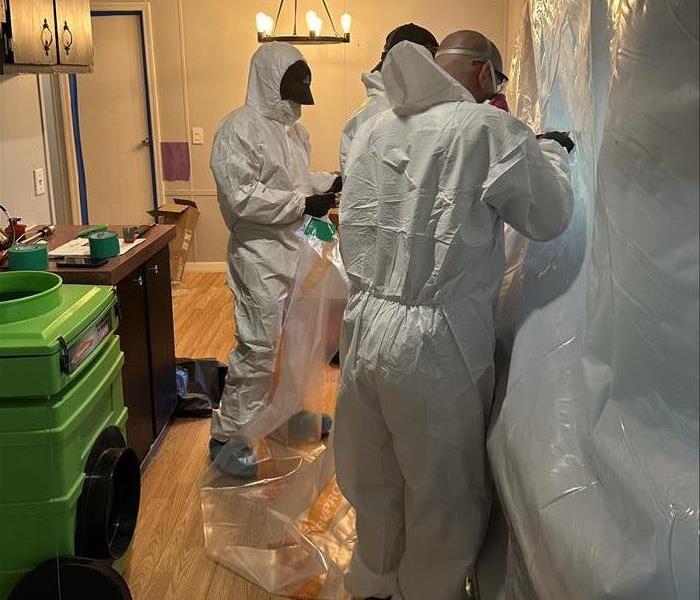 SERVPRO team using proper PPE gear during a biohazard job