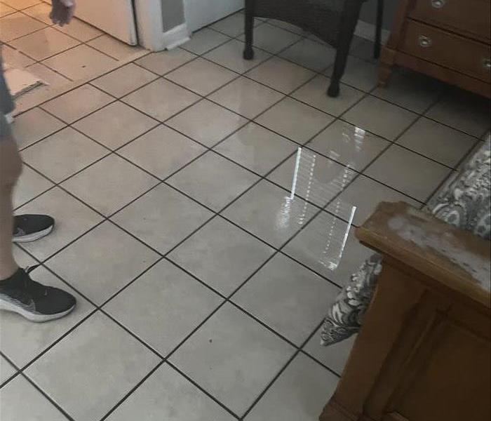 Puddled water inside the home from flooding